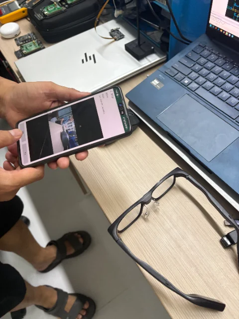 Close view of a phone test viewer displaying a C100 camera-stream preview