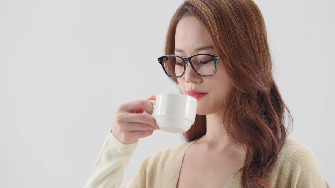 AR99 square-frame eyewear styling reference with a wearer holding a cup